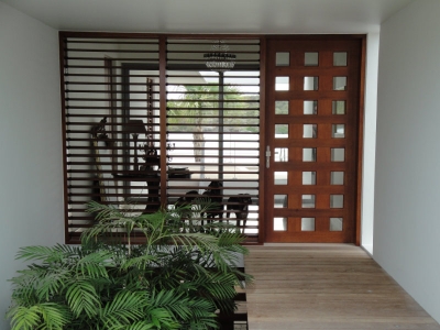 Entrance door with glass mosaic and louver windows